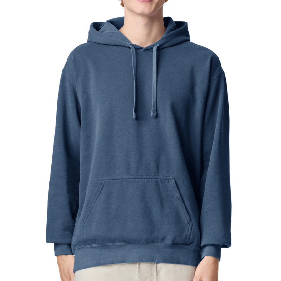 A person wearing a plain blue pullover hoodie with drawstrings and a front kangaroo pocket