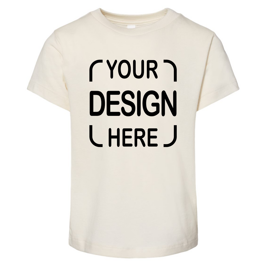 An off-white short-sleeve t-shirt with black placeholder text reading 'YOUR DESIGN HERE' printed on the front