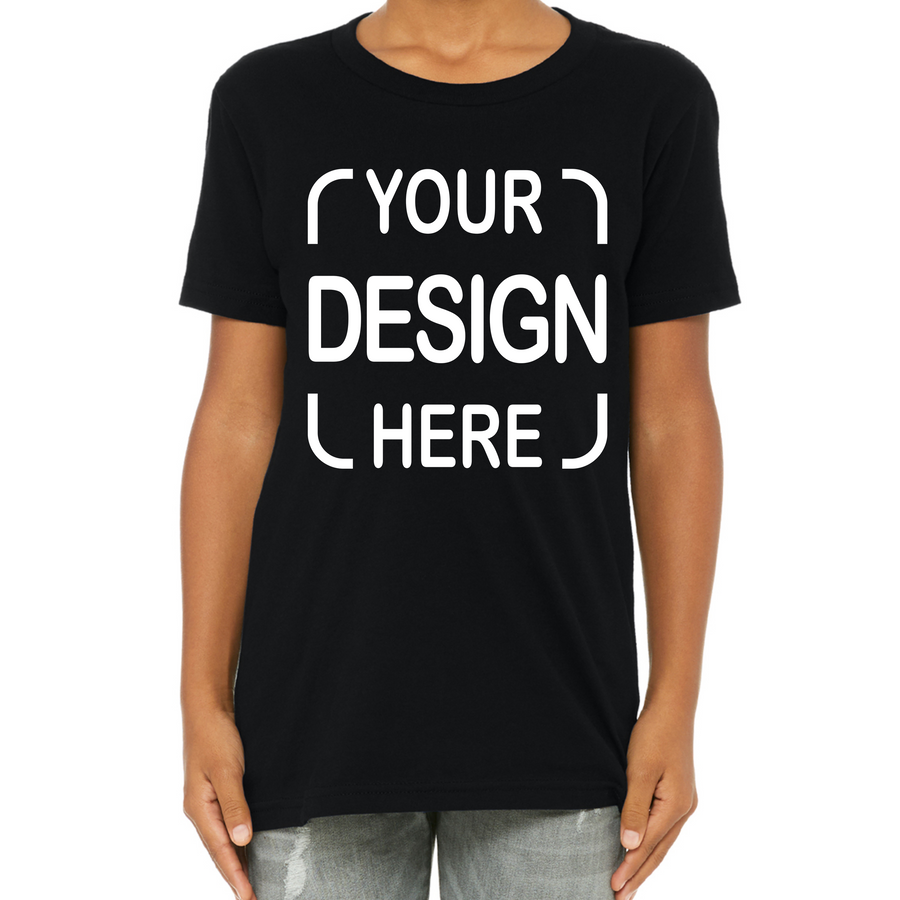 A person wearing a black short-sleeve crewneck T-shirt with white placeholder text reading 'YOUR DESIGN HERE' on the front