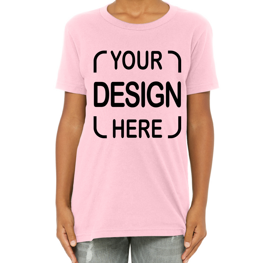 A person wearing a light pink short-sleeve T-shirt with black placeholder text reading 'YOUR DESIGN HERE' on the front