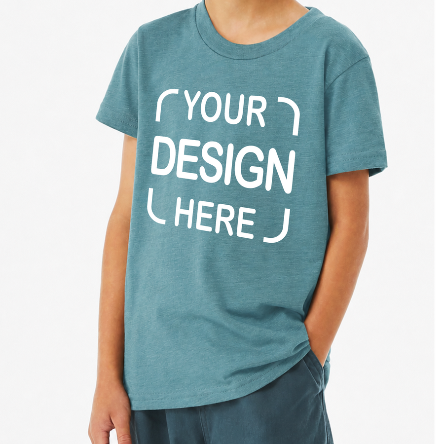 A person wearing a heathered teal-blue short-sleeve T-shirt with large white placeholder text reading 'YOUR DESIGN HERE' on the front