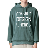 A person wearing a muted green pullover hoodie with a white customizable graphic print reading 'YOUR DESIGN HERE' on the front