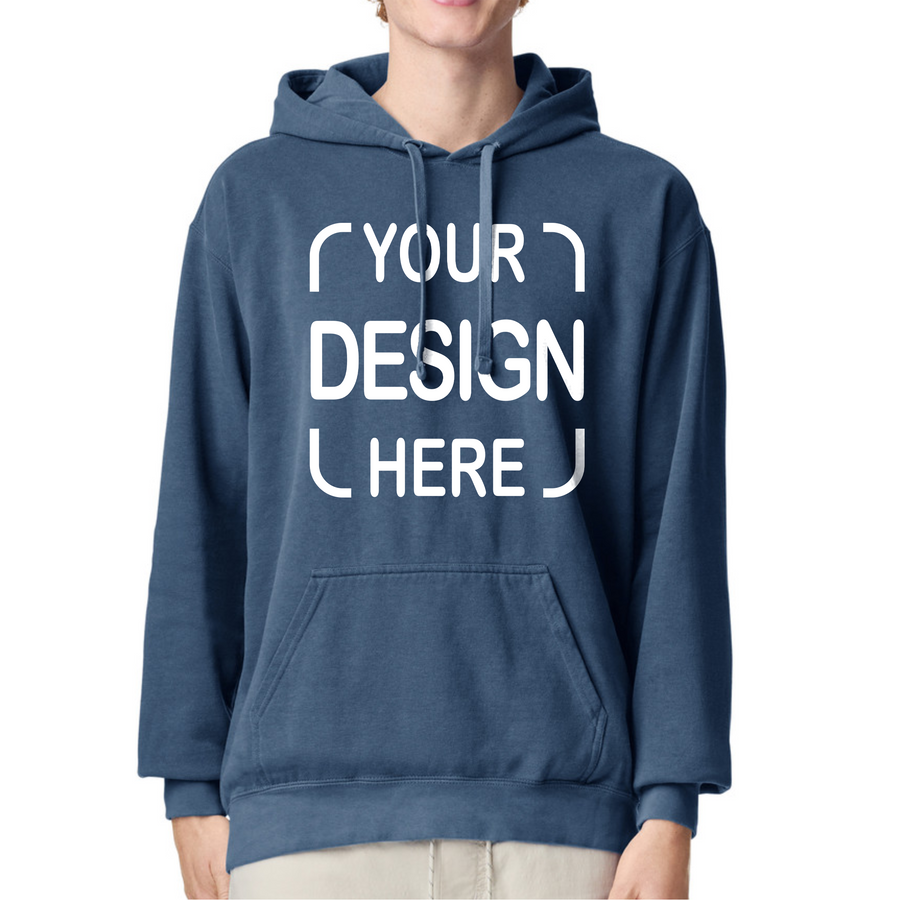 A person wearing a navy blue pullover hoodie with a white placeholder graphic reading 'YOUR DESIGN HERE' on the front