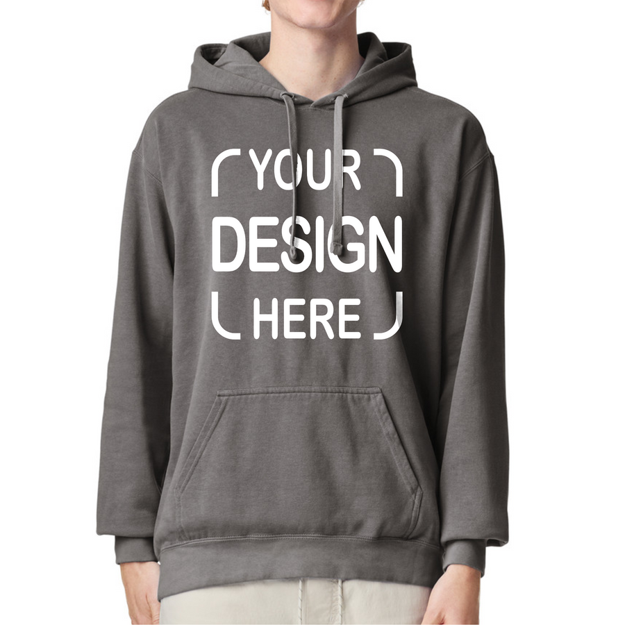 A person wearing a dark gray pullover hoodie with a white customizable graphic print that reads 'YOUR DESIGN HERE' on the front