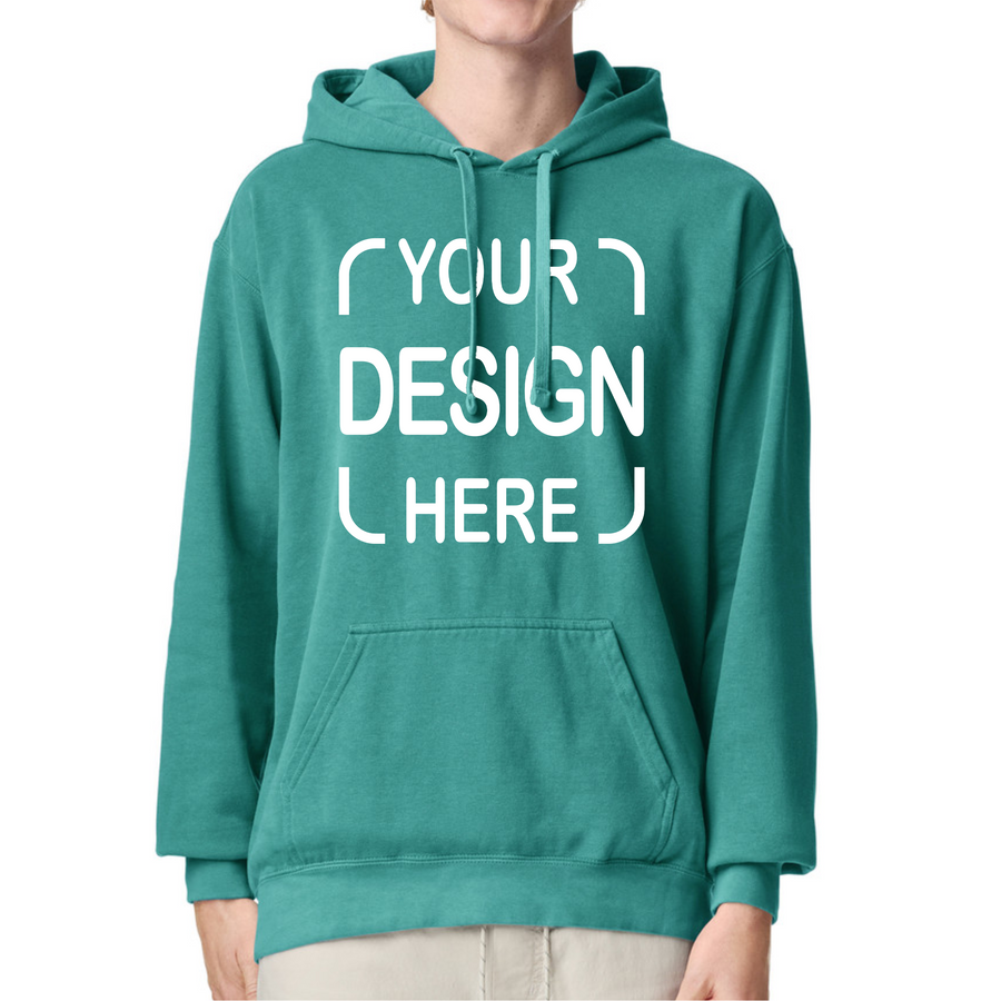A person wearing a teal pullover hoodie with a white 'YOUR DESIGN HERE' placeholder graphic on the chest